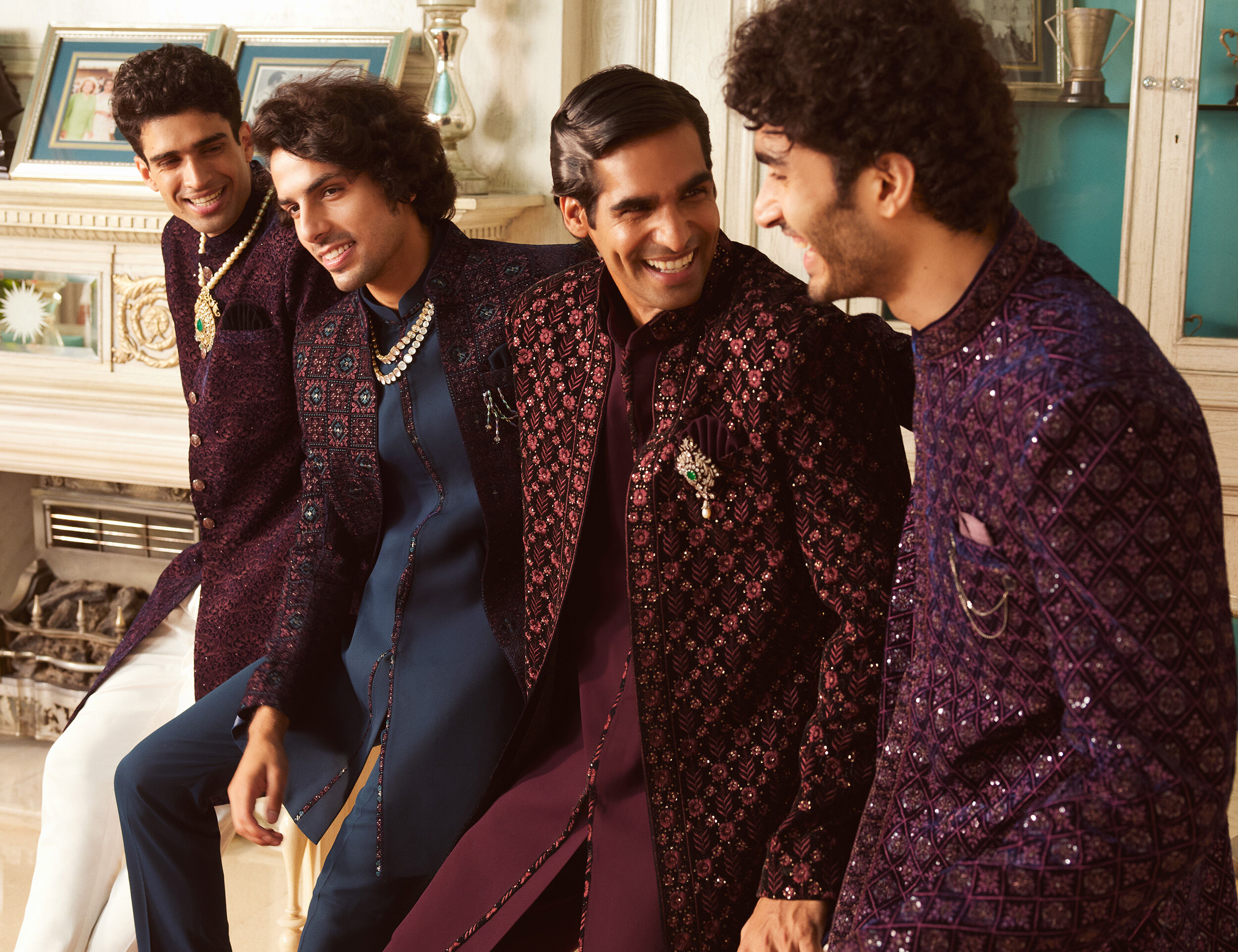 Groom and groomsmen in embroidered sherwanis styled with brooches, malas, and pocket squares, showcasing wedding accessories for men